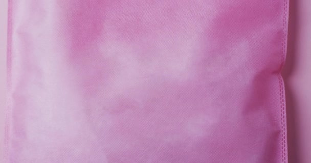 Video Růžové Plátěné Tašky Kopírovacím Prostorem Růžovém Pozadí Koncept Tašky — Stock video