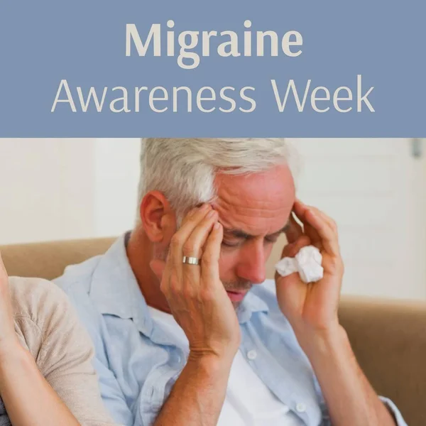 stock image Migraine awareness week text in grey on blue with senior caucasian man holding head in pain. Migraine, headaches, medical and health management awareness campaign, digitally generated image.