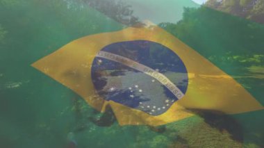 Kafkasyalı bir çiftin bahçede kızıyla hava manzarasında Brezilya bayrağı sallama animasyonu. Vatanseverlik ve aile kavramı