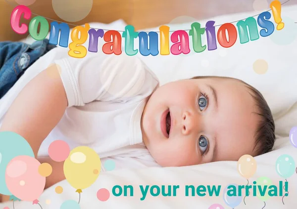 Composition of congratulations on your new arrival text and photo of caucasian baby. New baby, celebration and well wishing concept digitally generated image.