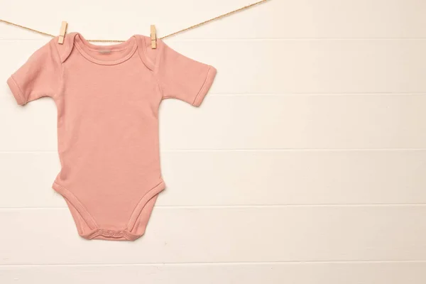 Pink Baby Grow Hanging Clothes Pegs Copy Space White Background — Stock Photo, Image