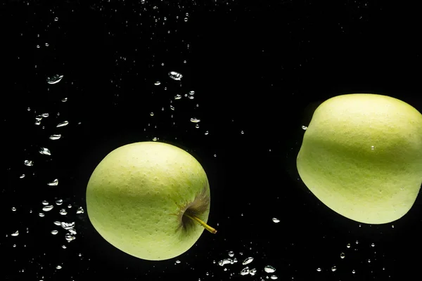 Close Green Apples Falling Water Copy Space Black Background Fruit — Stock Photo, Image