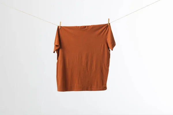 Brown Shirt Hanging Clothes Line Pegs Copy Space White Background — Stock Photo, Image