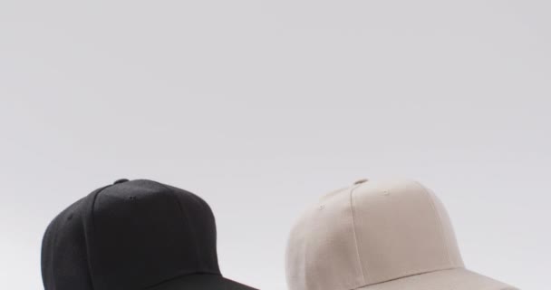 Video Black Beige Baseball Caps Copy Space White Background Headgear — Stock Video