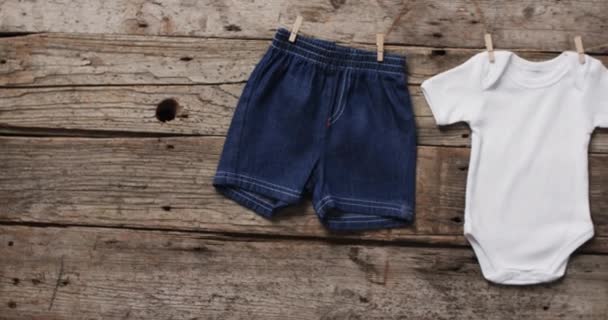 Video Baby Grow Denim Shorts Hanging Clothes Pegs Copy Space — Stock Video