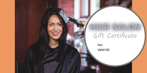 Composite of hair salon gift certificate text over diverse female hairdresser with female client. Hairdressing, hair and beauty and gift certificate offers concept digitally generated image.