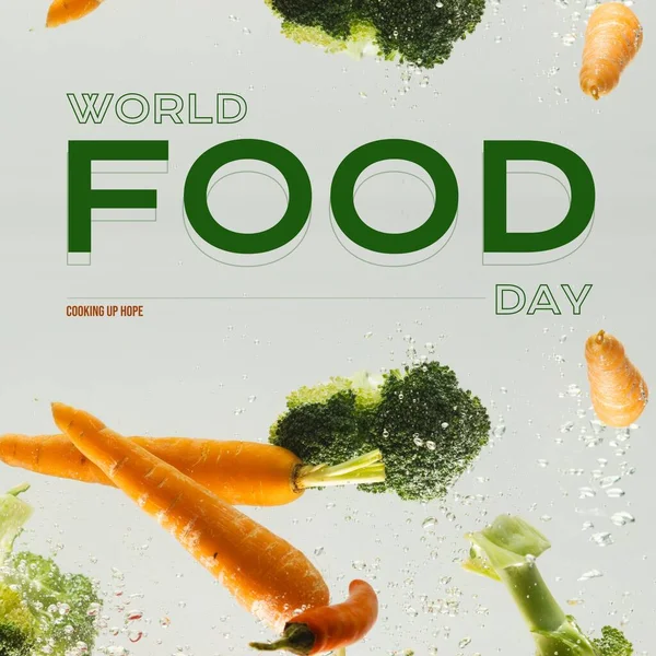 Composite of world food day text and carrots, broccoli floating in water on white background. Copy space, vegetable, hunger, food security, promote, awareness and celebrate concept.