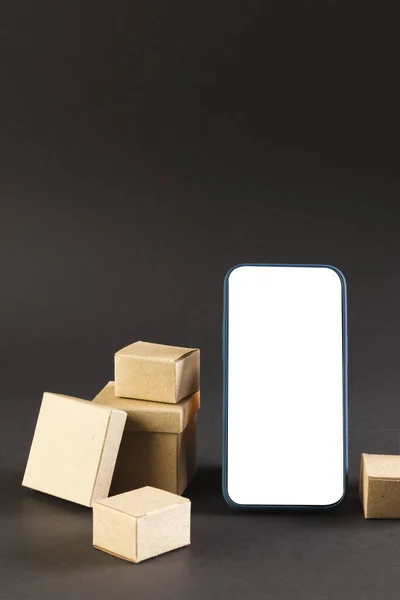 Vertical Image Smartphone Blank Screen Cardboard Boxes Copy Space Black — Stock Photo, Image