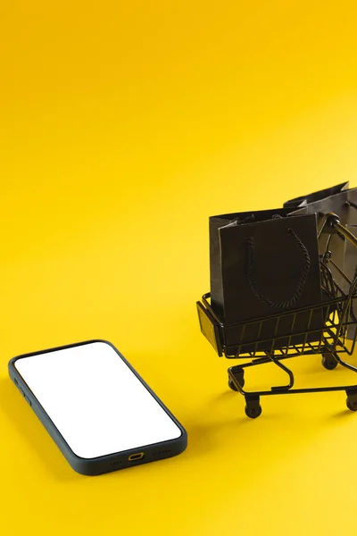 Vertical Image Smartphone Copy Space Trolley Bags Yellow Background Cyber — Stock Photo, Image