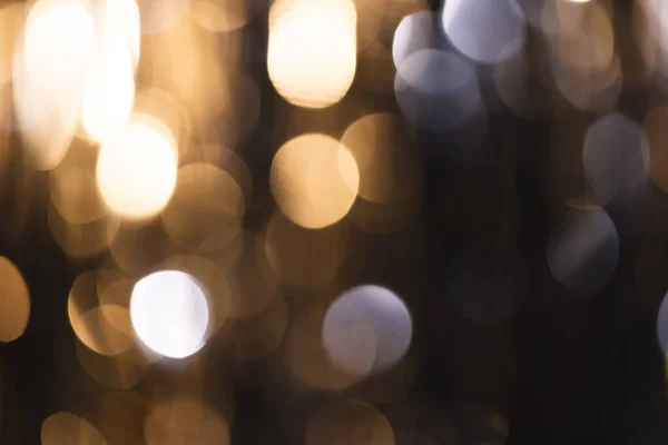 stock image White and blue bokeh lights with copy space on dark background. Light, colour and shape concept digitally generated image.