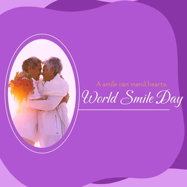 A smile can mend hearts world smile day text and senior diverse couple smiling. Smiling, happiness and facial expression concept digitally generated image.