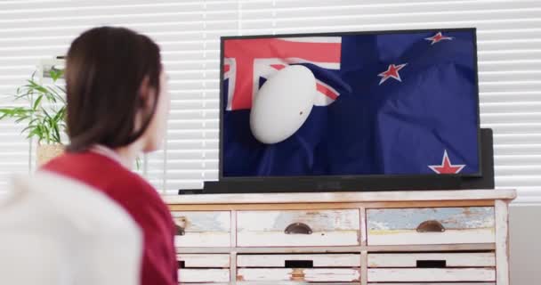 Caucasian Woman Watching Rugby Ball Flag New Zeland Screen Communication — Stock Video