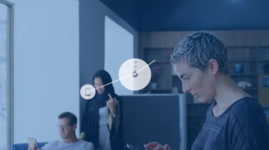 Animation of network of digital icons against caucasian woman using digital tablet at office. Global networking and business technology concept