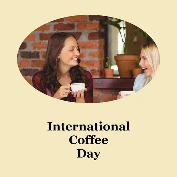 International coffee day text on cream with happy caucasian female friends drinking coffee in cafe. Coffee drinking appreciation and promotional campaign concept digitally generated image.