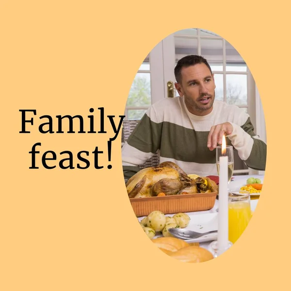 Family feast text with caucasian man sitting at thanksgiving dinner table. Thanksgiving, harvest festival, american tradition, family and autumn celebration digitally generated image.