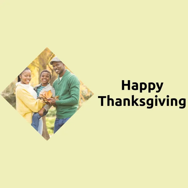 Happy thanksgiving text on yellow with happy african american parents and son in park. Thanksgiving, harvest festival, american tradition, family and autumn celebration digitally generated image.