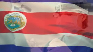 Çeşitli erkek ve kadın cerrahların hastanede ameliyat yapmaları üzerine Costa rica bayrağının animasyonu. Tıbbi sağlık ve vatanseverlik kavramı