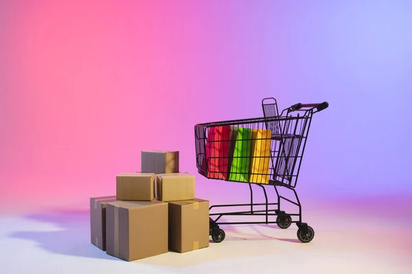 Shopping Trolley Bags Boxes Copy Space Neon Purple Background Cyber — Stock Photo, Image