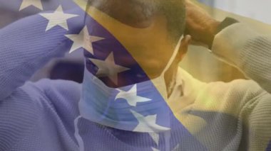 Sokakta maskeli Afro-Amerikan bir adam için Bosna ve Herzegovina 'ya el sallamanın animasyonu. Küresel covid-19 salgın konsepti