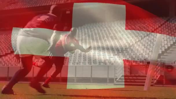 Animación Bandera Suiza Jugador Afroamericano Persiguiendo Pelota Rugby Sostenida Por — Vídeo de stock