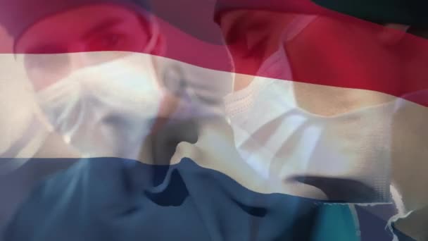 Animazione Della Bandiera Dei Paesi Bassi Diversi Chirurghi Maschi Femmine — Video Stock