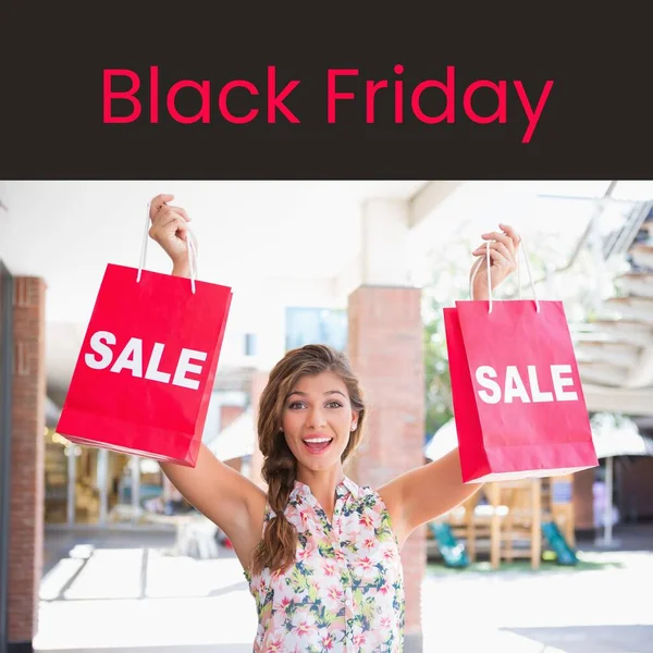 Black friday text in red with happy caucasian woman holding sale bags at mall. Retail shopping and business sale promotion concept digitally generated image.