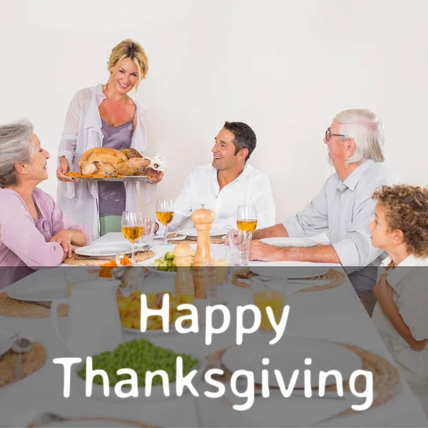 Happy thanksgiving text over happy caucasian woman bringing turkey to family dinner table. Thanksgiving, harvest festival, american tradition, family and autumn celebration digitally generated image.