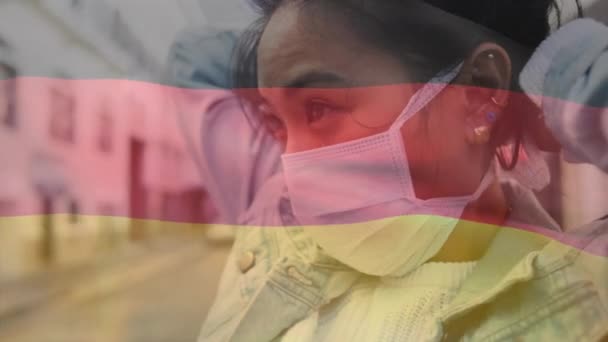 Animation Waving Germany Flag Asian Woman Wearing Face Mask Street — Stock Video