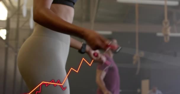 在体操馆进行男女跳绳交叉训练的图解处理数据的动画制作 数字接口和数字视频技术 — 图库视频影像