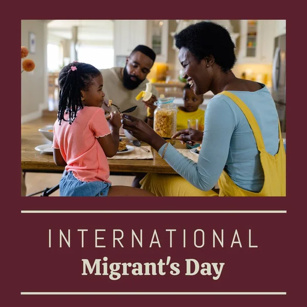 Composite of international migrants day text and african american mother feeding daughter at home. Family, love, together, childhood, breakfast, refugee, freedom, promote, support and celebration.