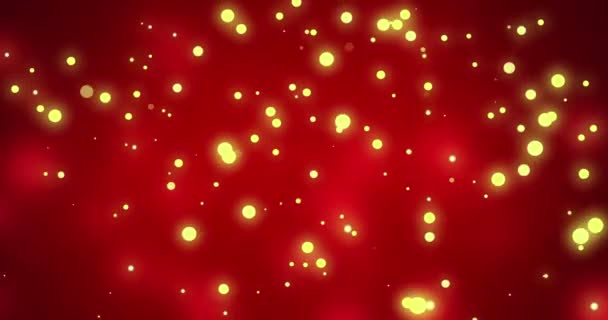 Bersinar Kuning Natal Partikel Cahaya Bergerak Melintasi Merah Bokeh Latar — Stok Video