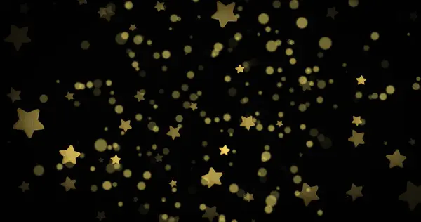 Composition of gold stars and spots on black background. Christmas tradition and celebration concept digitally generated image.