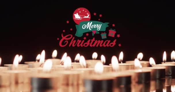 在点燃的茶灯的背景上动画化的快乐圣诞文字 圣诞节 传统和庆祝概念数字制作的录像 — 图库视频影像