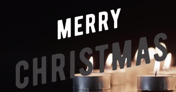 Animace Veselého Vánočního Textu Nad Zapálenými Čajovými Svíčkami Černém Pozadí — Stock video