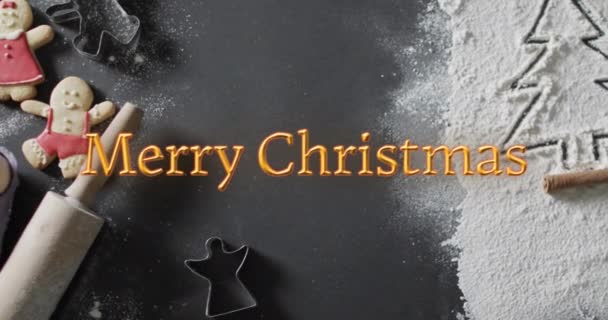 Frohe Weihnachten Text Orange Über Baum Mehl Nudelholz Und Plätzchen — Stockvideo