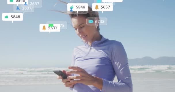 Animation Social Media Data Processing Caucasian Woman Smartphone Beach Global — Stock Video