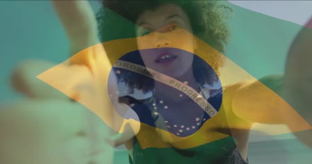 Animation Flag Brazil Waving Biracial Woman Talking Selfie Video Camera — Stock Video