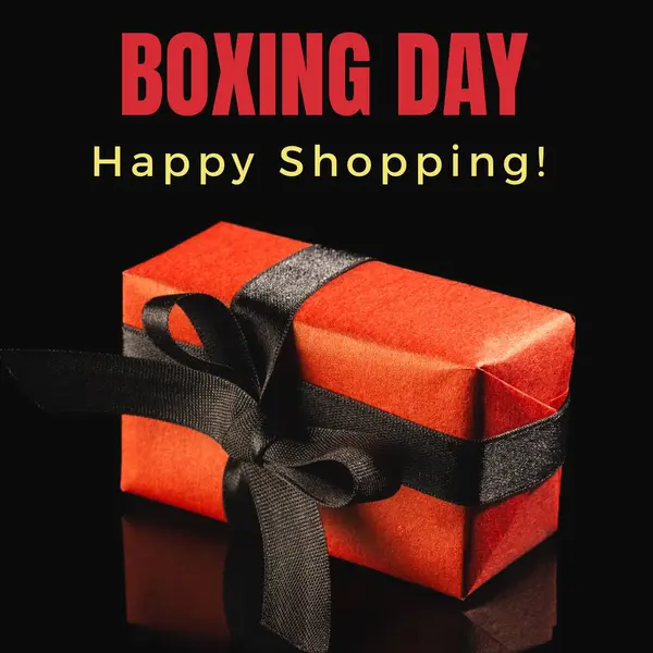 Composite of boxing day and happy shopping text over red gift box on black background, copy space. Shopping, sale, surprise, discount, marketing, template, design, retail, advertise concept.