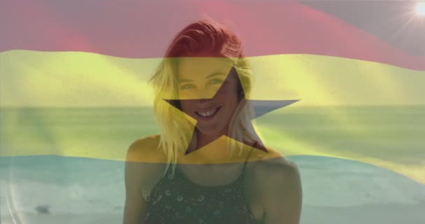 Animation Waving Flag Ghana Smiling Caucasian Woman Standing Sea Beach — Stock Video