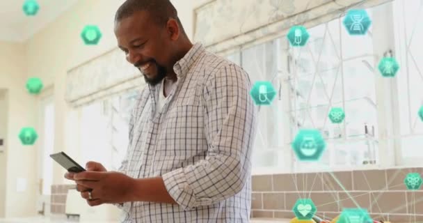 Animation Connected Icons Globes Smiling African American Man Using Smartphone — Stock Video