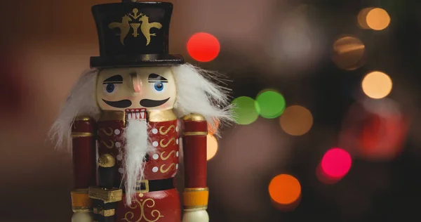 Traditional Wooden Nutcracker Soldier Figure Coloured Bokeh Christmas Lights Background — Stock Photo, Image