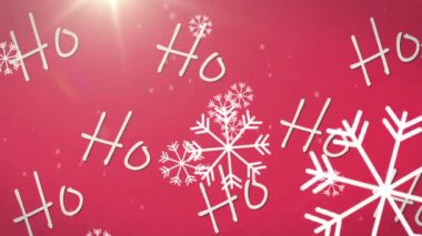Kırmızı arka planda ho ho ho metninin üzerine düşen Noel kar tanelerinin animasyonu. Noel, kış, kutlama ve geleneksel konsept dijital olarak oluşturulmuş video.