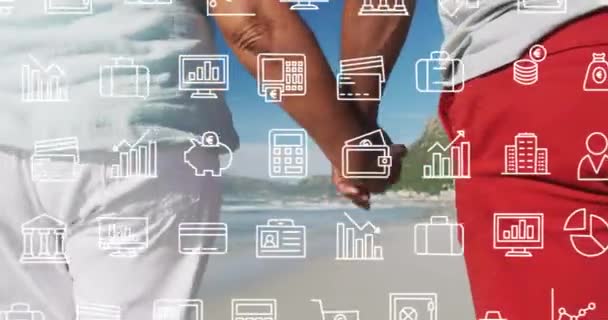 Animation Multiple Icons Midsection Diverse Couple Holding Hands Walking Beach — Stock Video