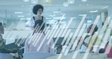 Animation of financial data processing over diverse business people in office. Global business, finances, computing and data processing concept digitally generated video.