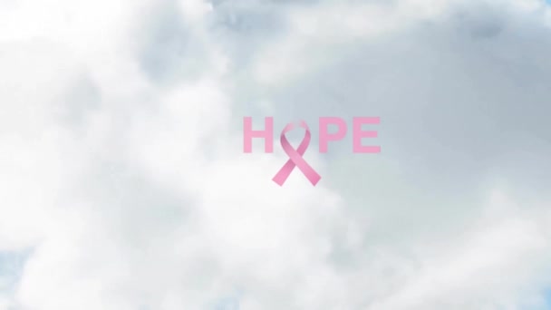 带着丝带的希望文字在天空中飘扬着浓密的云彩 数码合成 多次曝光 乳腺癌宣传运动 慈善和抽象概念 — 图库视频影像