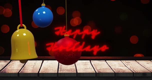 Анимация Светящихся Красных Праздничных Текстов Бликов Цветными Безделушками Над Столом — стоковое видео