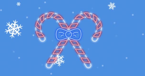 在带有复制空间的蓝色背景下 雪片落在霓虹灯手杖图标上的动画 圣诞庆典和庆祝活动的概念 — 图库视频影像