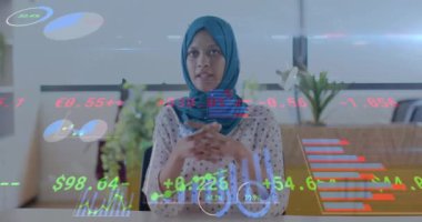 Animation of financial data processing over diverse businesswomen in office. Global business, finance, computing and data processing concept digitally generated video.
