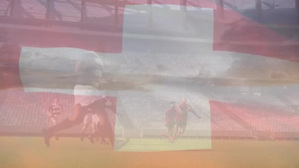 Animacja Szwajcarskiej Flagi Nad Drużyną Różnorodnych Męskich Rugby Graczy Grających — Wideo stockowe