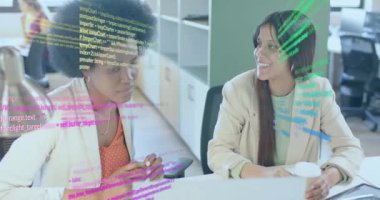 Animation of financial data processing over diverse businesswomen in office. Global business, finance, computing and data processing concept digitally generated video.